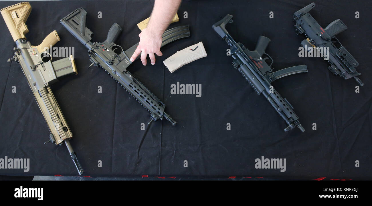 Berlin, Germany. 20th Feb, 2019. Participants of the 22nd European Police Congress will inform themselves in the Congress Centrum at Alexanderplatz about weapons exhibited by Heckler and Koch. L-r: assault rifle HK 417, assault rifle G38, submachine gun MP5 and submachine gun MP7. Credit: Wolfgang Kumm/dpa/Alamy Live News Stock Photo