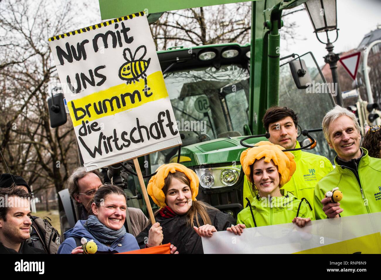Munich, Bavaria, Germany. 20th Feb, 2019. ''Only with us does the economy buzz''. Activists wear bee outfits as part of the celebration of a successful citizen initiative to save the bees in Bavaria, Germany. After being deemed the most successful citizen initiative in the history of Bavaria with over 1.7 million signatures collected representing 18.4% of Bavaria, the groups behind the Volksbegehren Artenvielfalt, aka Save the Bees and Citizens' Initiative Species Diversity continue their work towards entering the initiative into law. The Save the Bees initiative is designed to put mea Stock Photo
