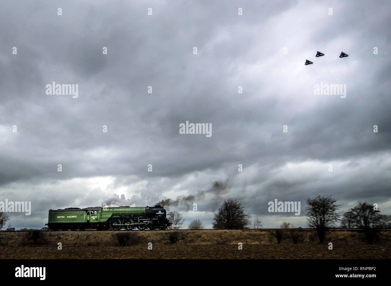 Three RAF Tornados fly past the Tornado train near Leeming Bar in Yorkshire during their farewell tour. Stock Photo