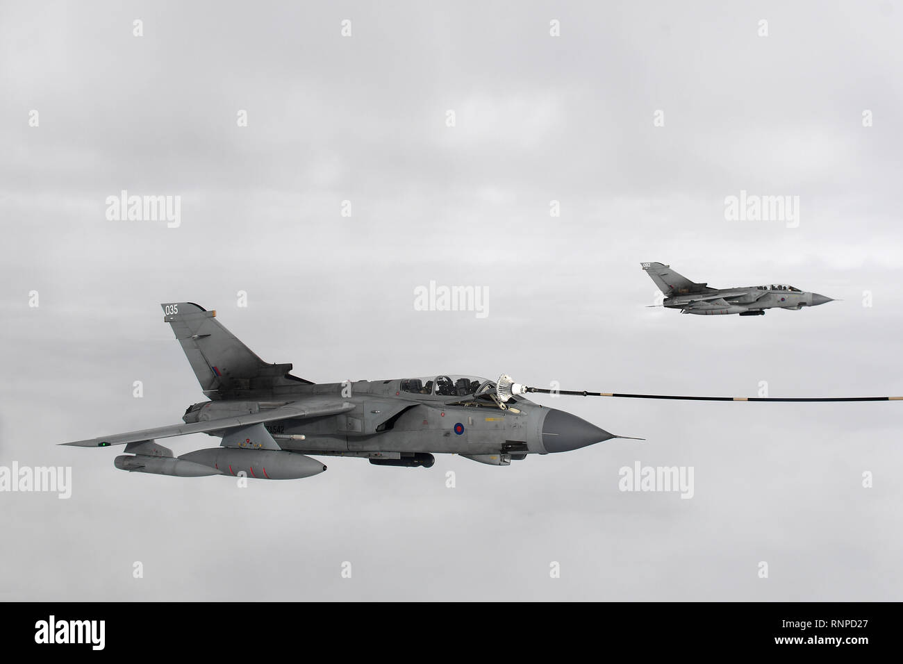 Tornado GR4's refuel from an RAF Voyager as they take part in a three day farewell flypast over airfields, defence bases and other sites of significance. Stock Photo