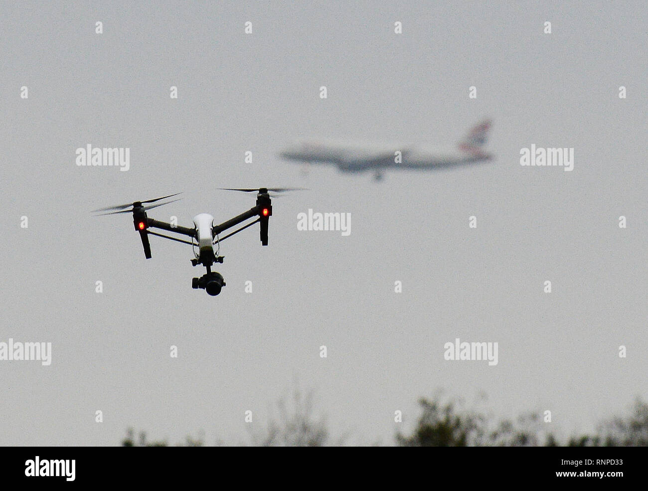 A drone flies in Hanworth Park in west London, as a British Airways 747 plane prepares to land at Heathrow Airport behind. ... Drone stock ... 25-02-2017 ... London ... UK ... Photo credit should read: John Stillwell/PA Archive. Unique Reference No. 30281224 ... Picture date: Saturday February 25, 2017. Photo credit should read: John Stillwell/PA Wire Stock Photo