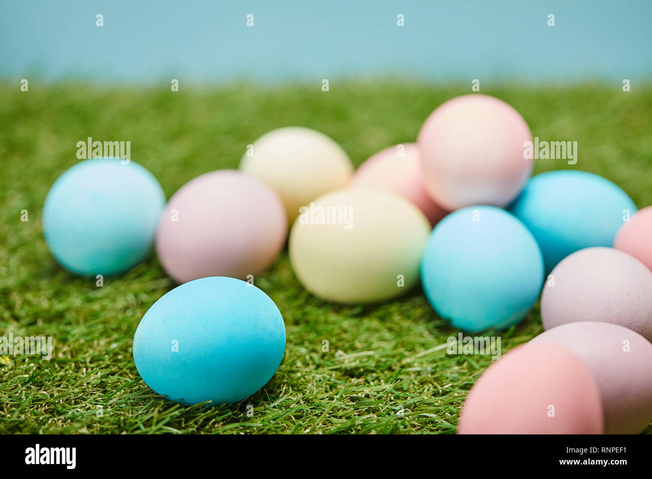 selective focus of easter painted eggs on grass Stock Photo