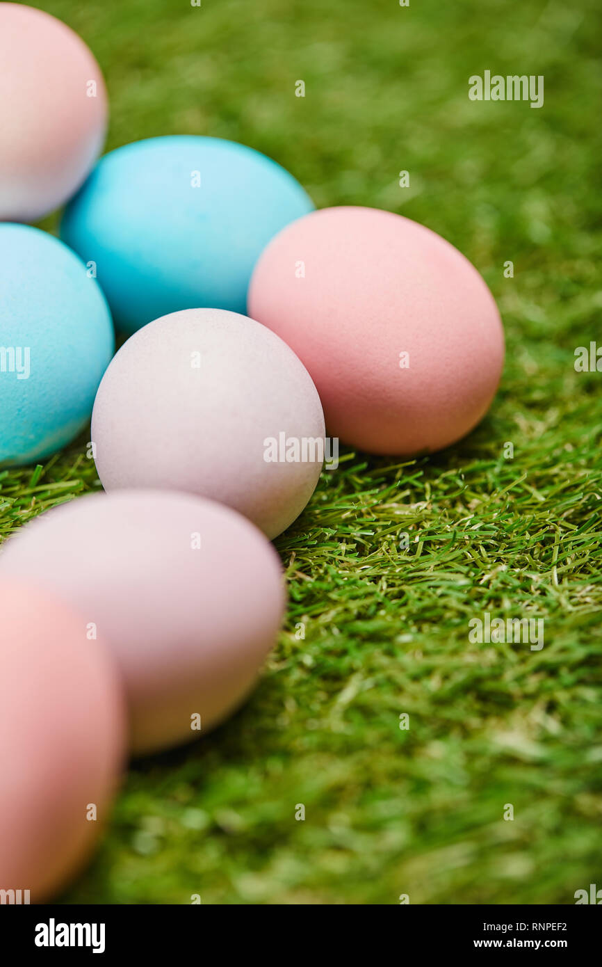selective focus of painted easter eggs on grass Stock Photo