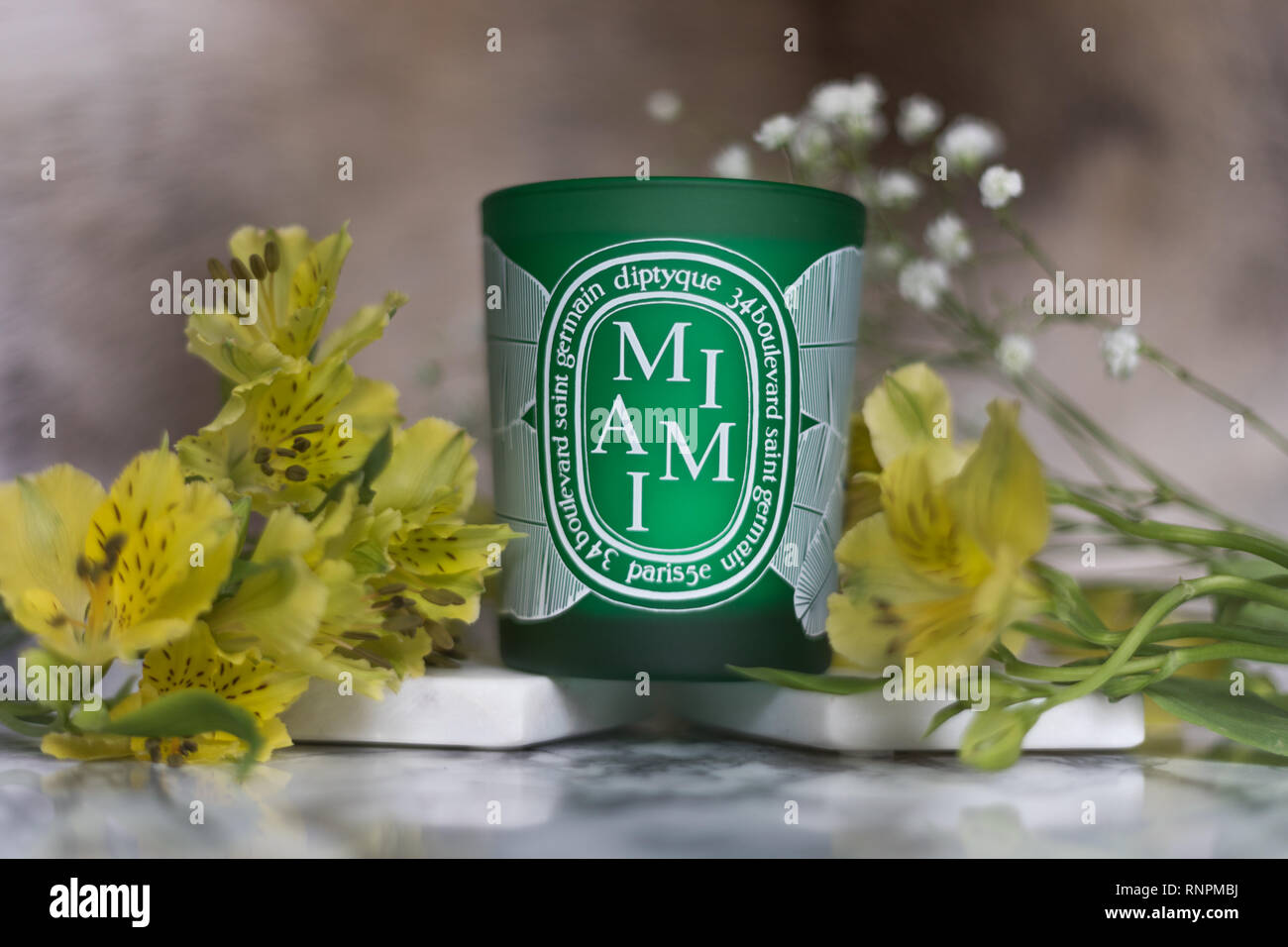 Diptyque Luxury candle with floral composition and marble effect for your home Stock Photo
