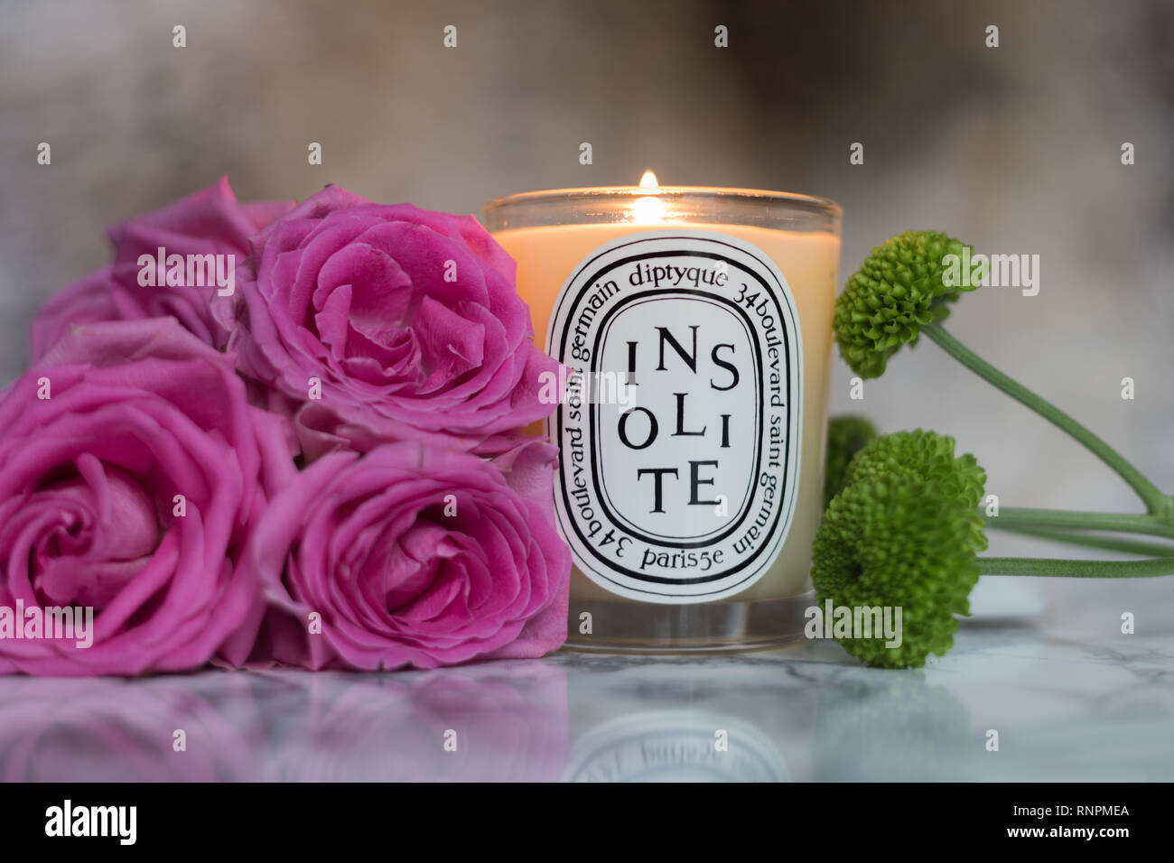 Diptyque Luxury candle with floral composition and marble effect for your home Stock Photo