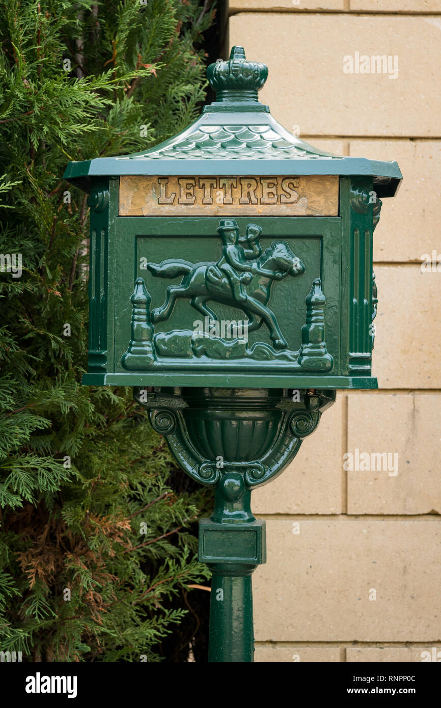Old vintage green mailbox made of iron, french inscription letters Stock Photo
