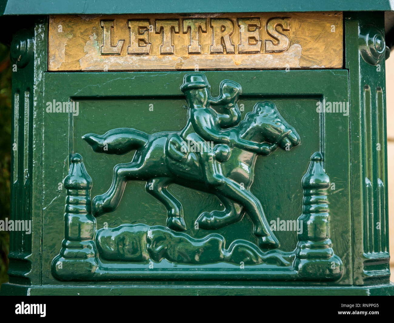 Old vintage green mailbox made of iron, french inscription letters Stock Photo