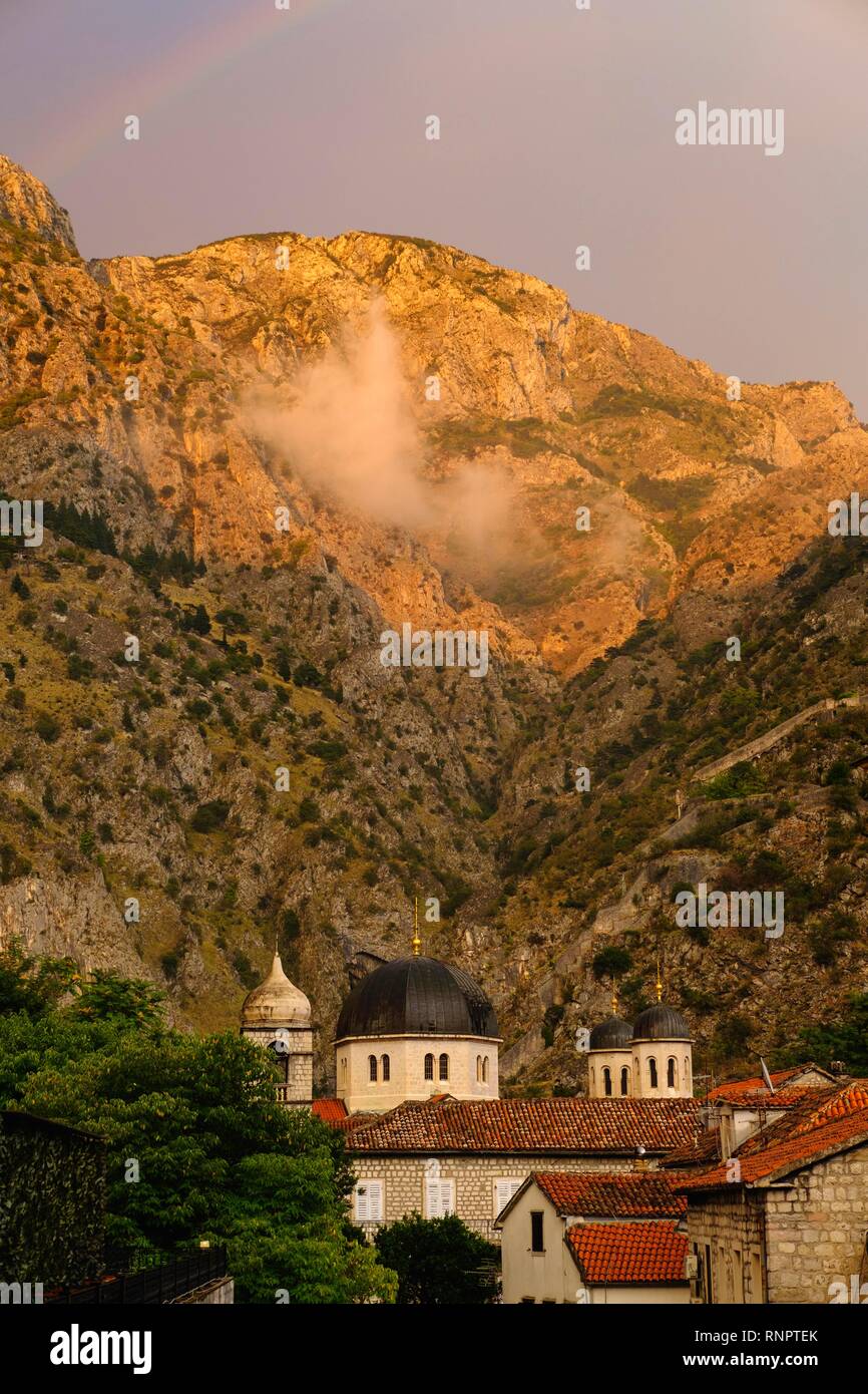 Rainbow over the mountain and church Sv. Marija Koledata, mountain Volujak, old town Kotor, Montenegro Stock Photo