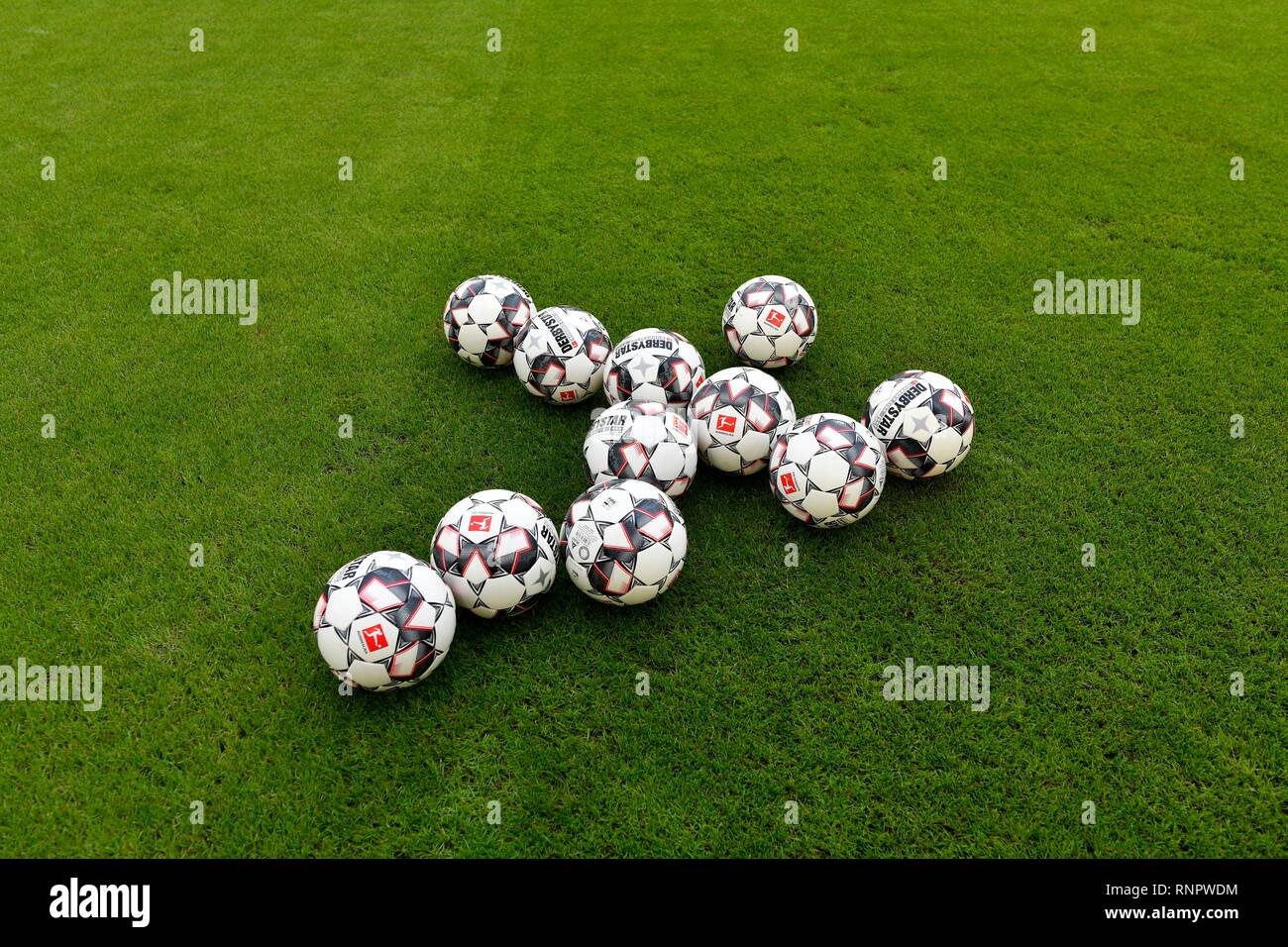 11 match balls adidas DerbyStar on grass, Mercedes-Benz Arena, Stuttgart, Baden-Württemberg, Germany Stock Photo