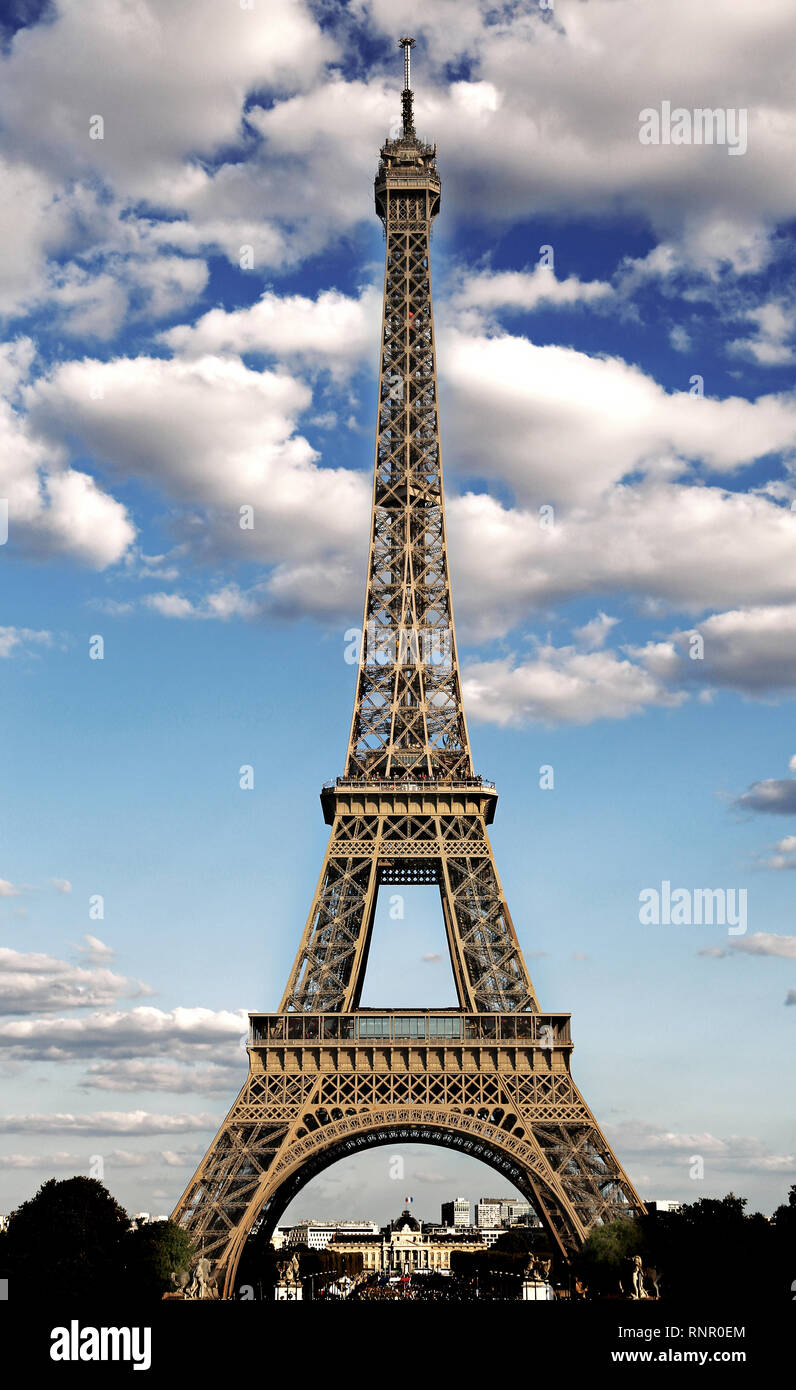 majestic eiffel tower symbol of the city of paris with HDR effect and the white clouds in the blue sky Stock Photo