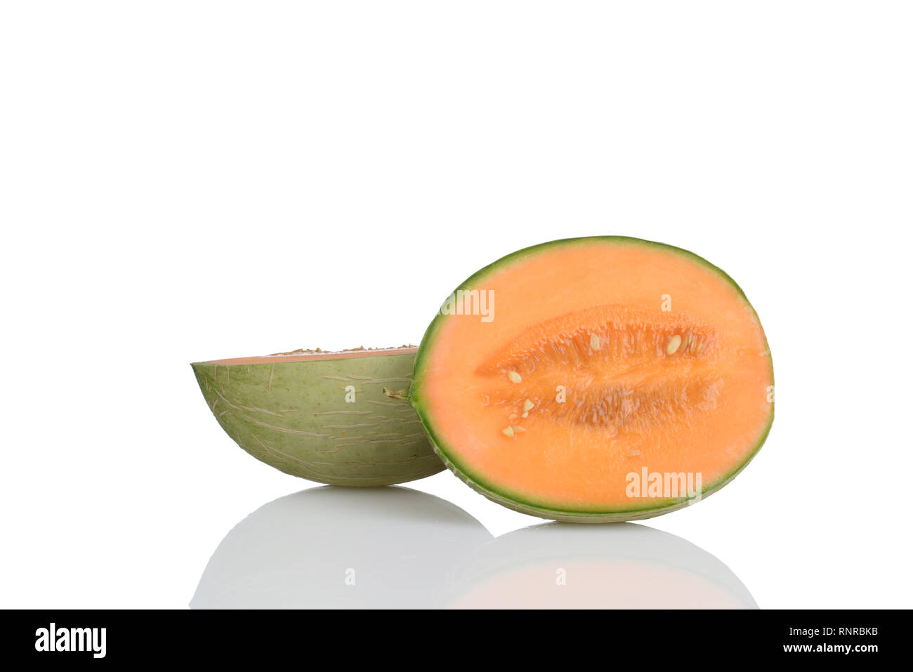 Hybrid cantaloupe honeydew melon sliced in half Stock Photo Alamy