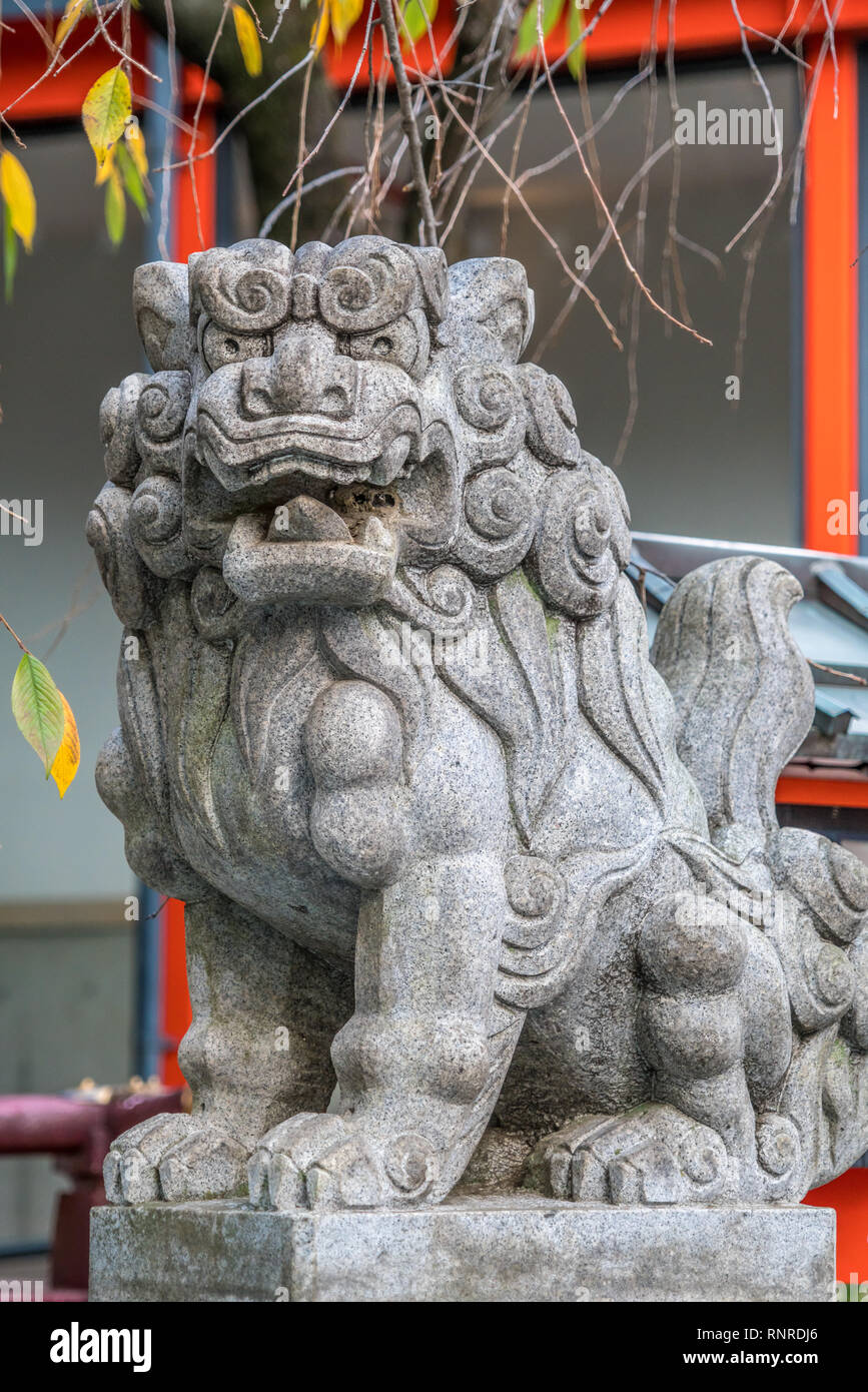 Stone carved Komainu Liondog guardian at Suzukamyo Shrine, Located in