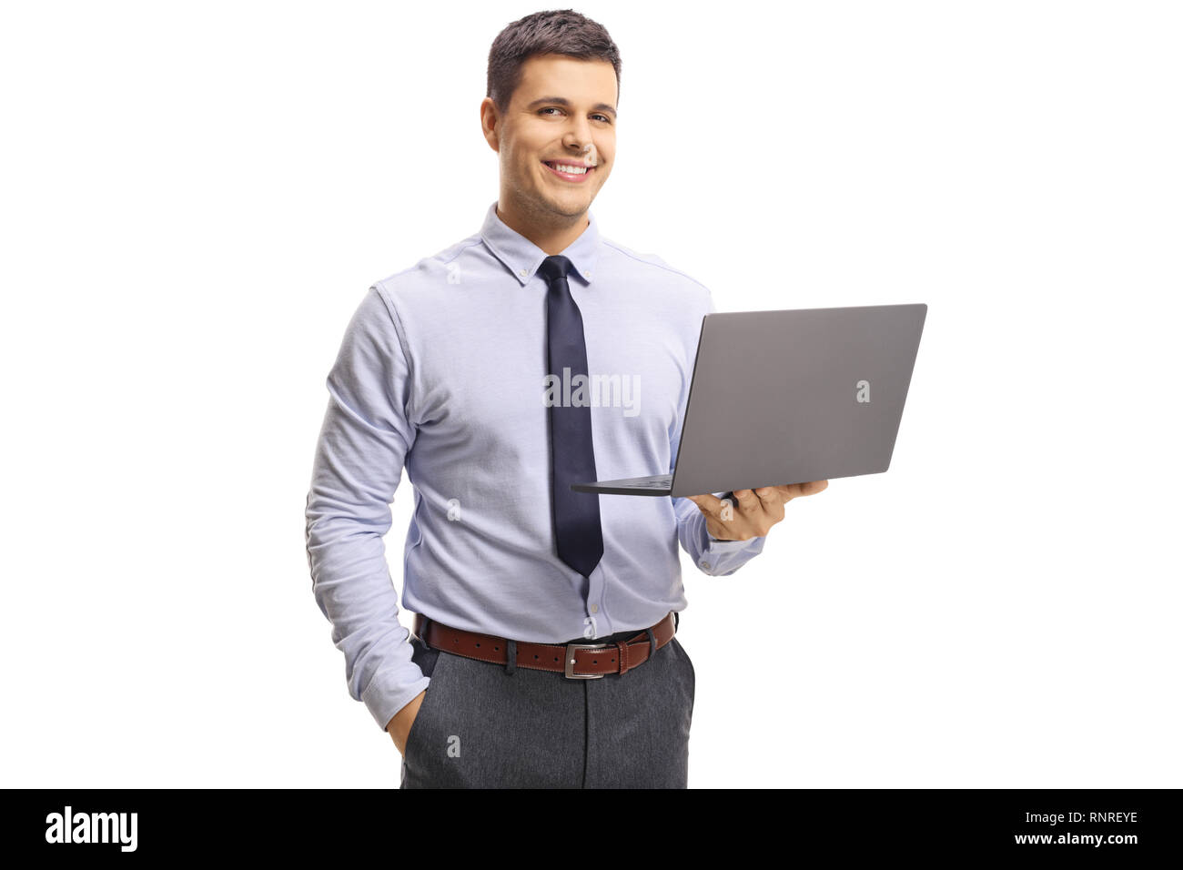 Young handsome man wearing shirt and tie, holding a laptop computer and ...