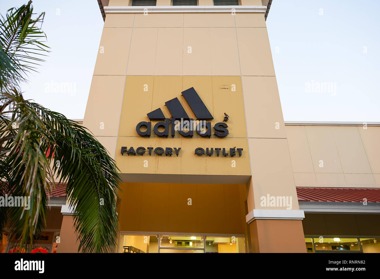 PATTAYA, THAILAND - FEBRUARY 21, 2016: Adidas outlet in Pattaya. Adidas AG is a German multinational corporation that designs and manufactures sports Photo -