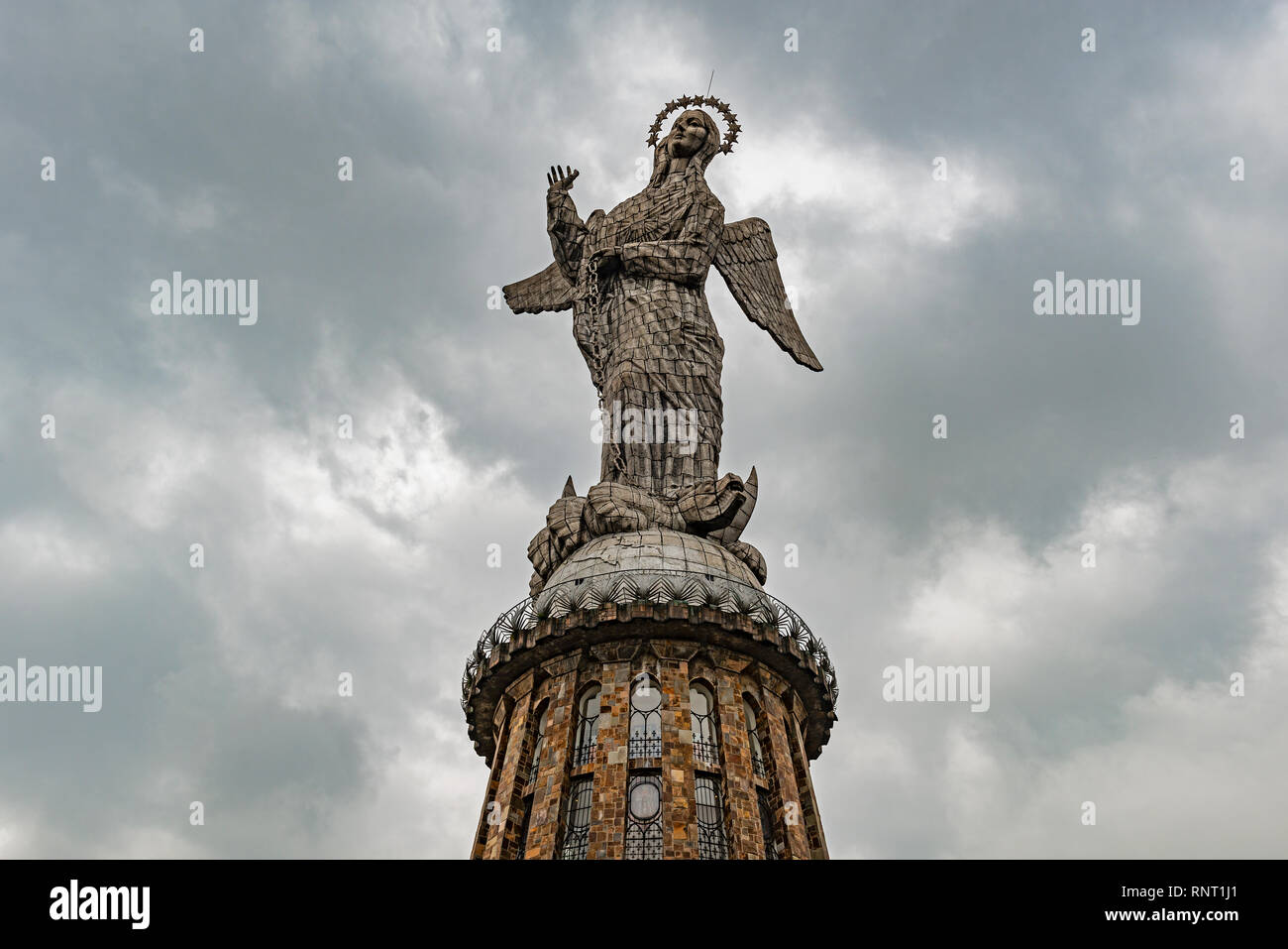 The Virgin of Quito, winged virgin or apocalyptic virgin with observation tower on the Panecillo Hill of Quito, Ecuador. Stock Photo