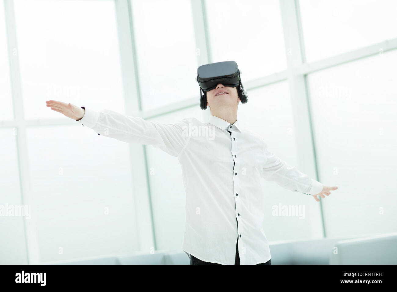 young men testing virtual reality glasses in office Stock Photo