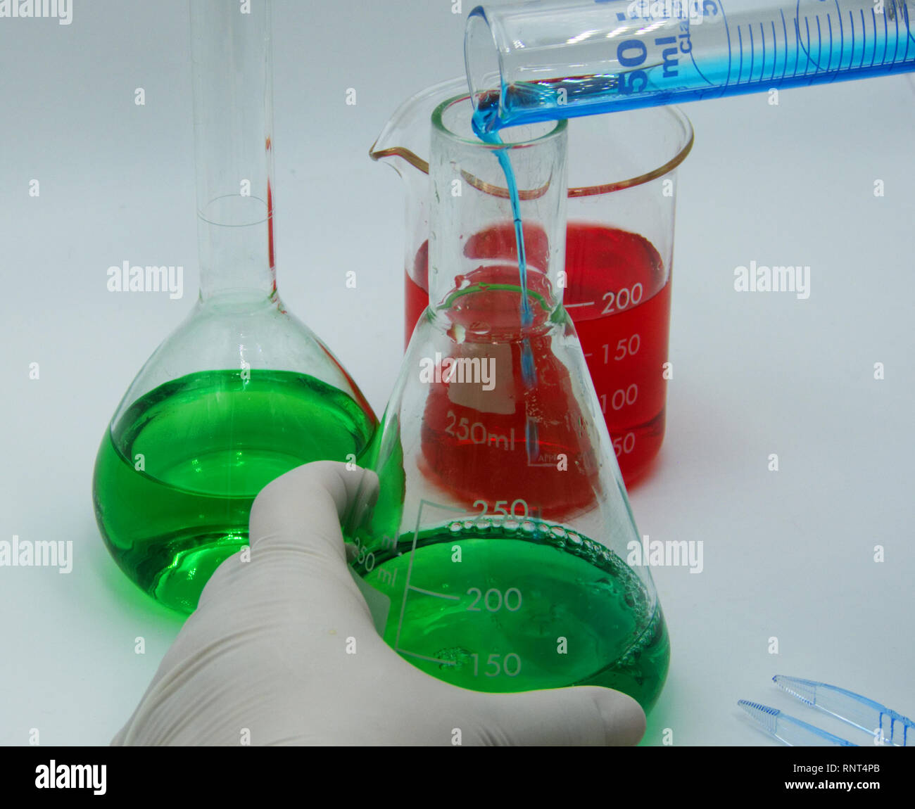 Laboratory technician conducts experiments on white background Stock Photo Alamy
