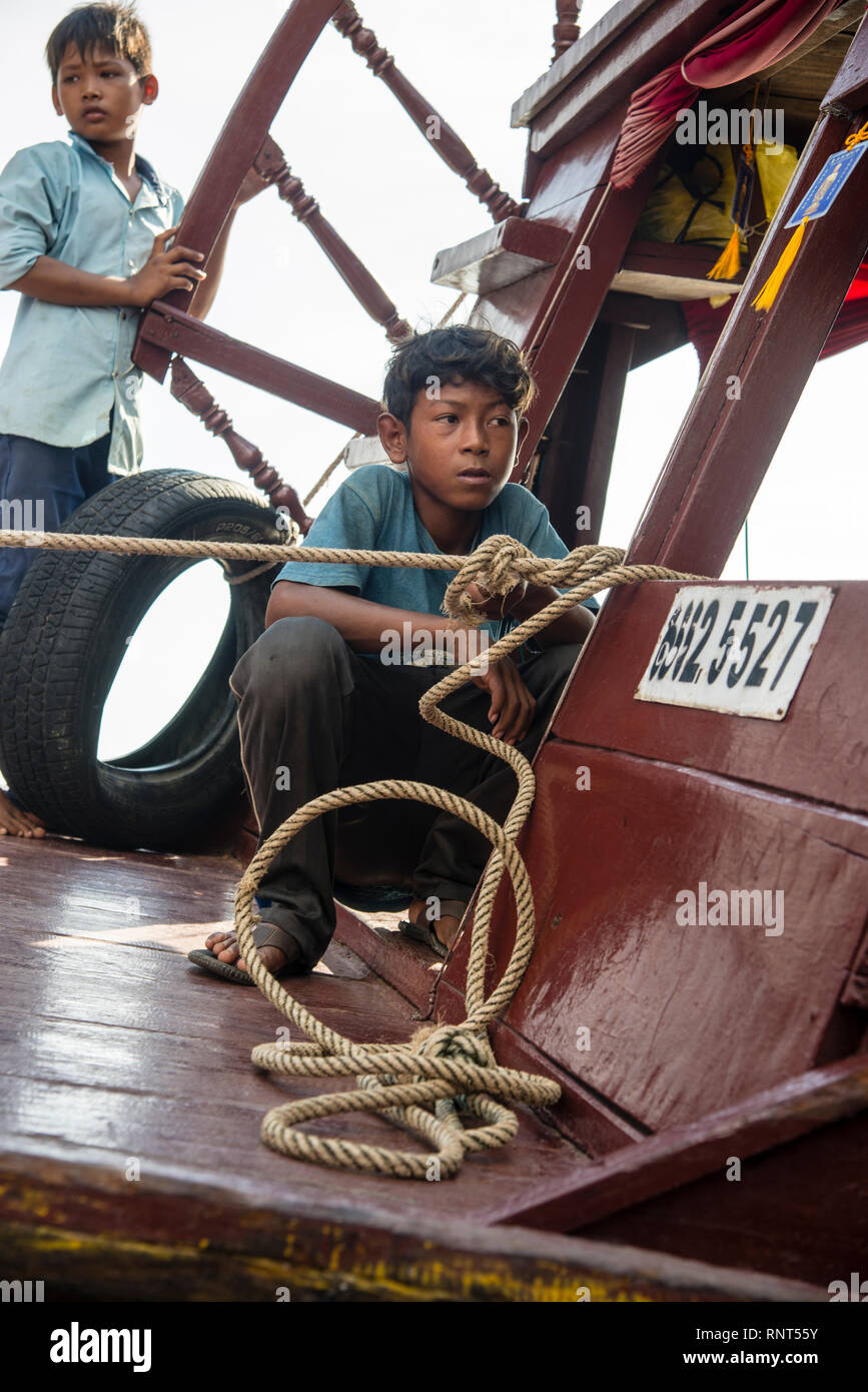 Young boys on the Tonle Sap Lake in Siem Reap, Cambodia in Southeast Asia. Stock Photo
