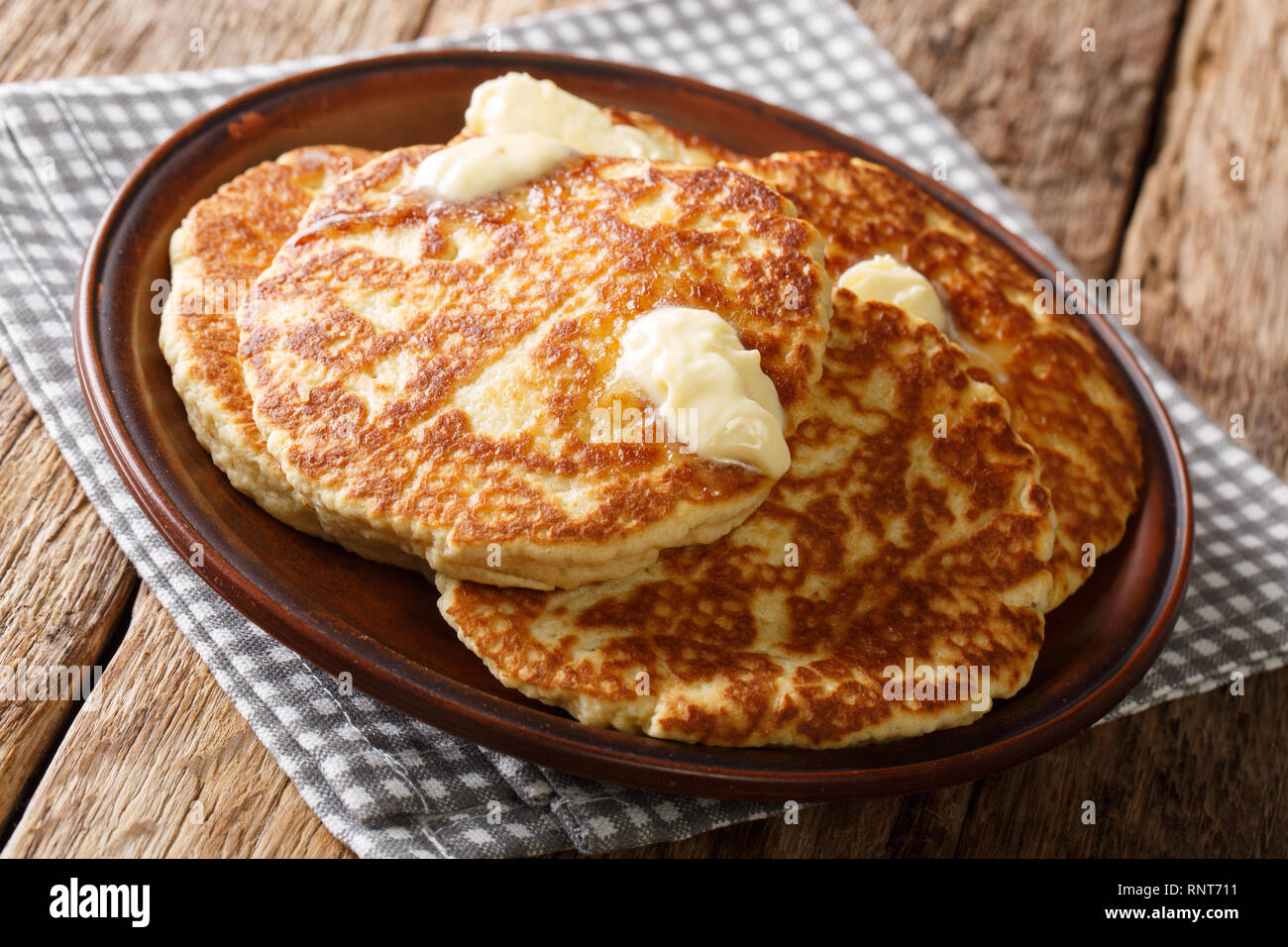 Homemade Gorditas de Azucar Sweet Griddle Cakes with butter closeup on