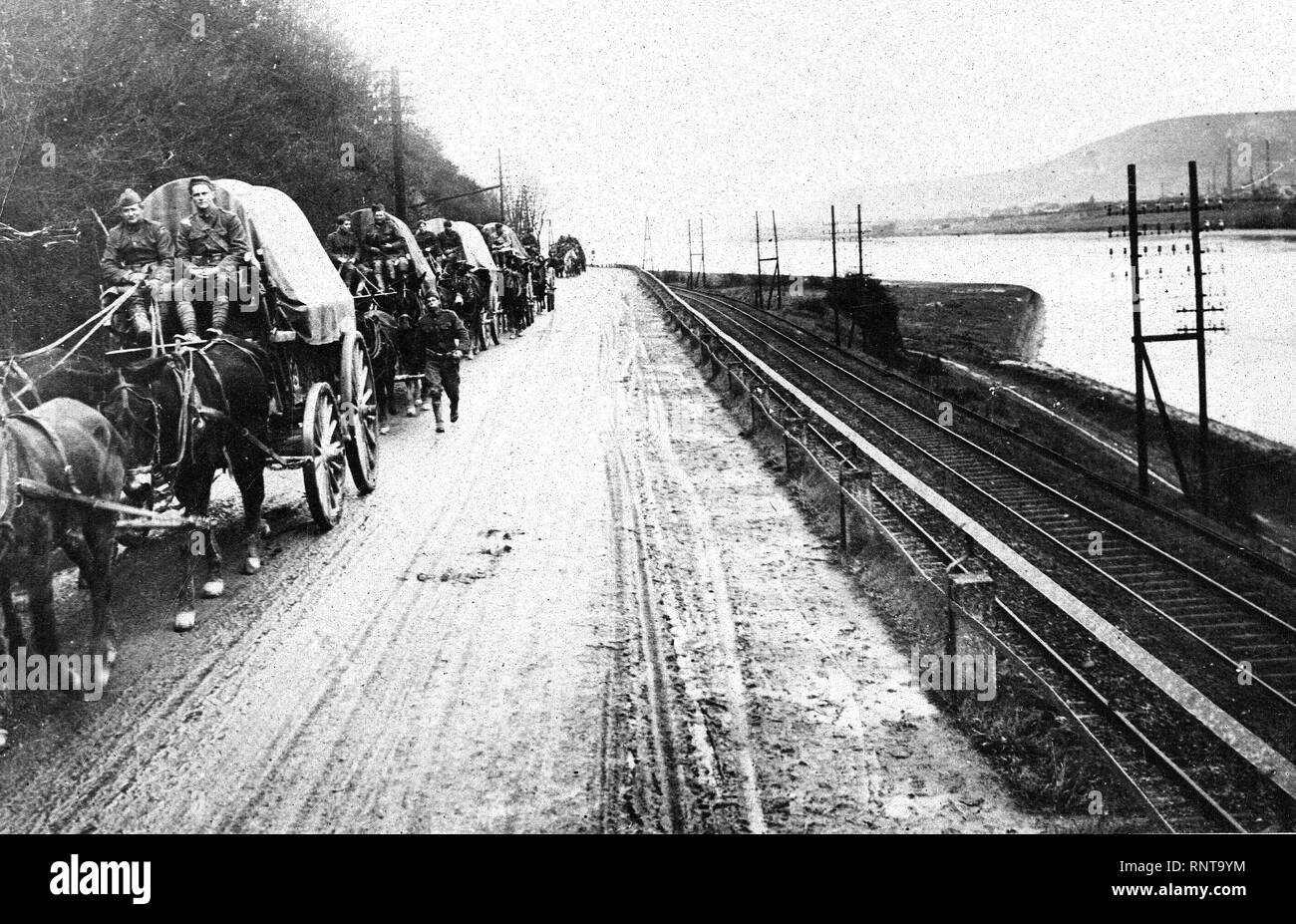 January 1919 - Army of Occupation - American Army crossing Rhine River, Germany. Army Trucks on road between Coblenz and Bonn on the left bank of the Rhine river Stock Photo