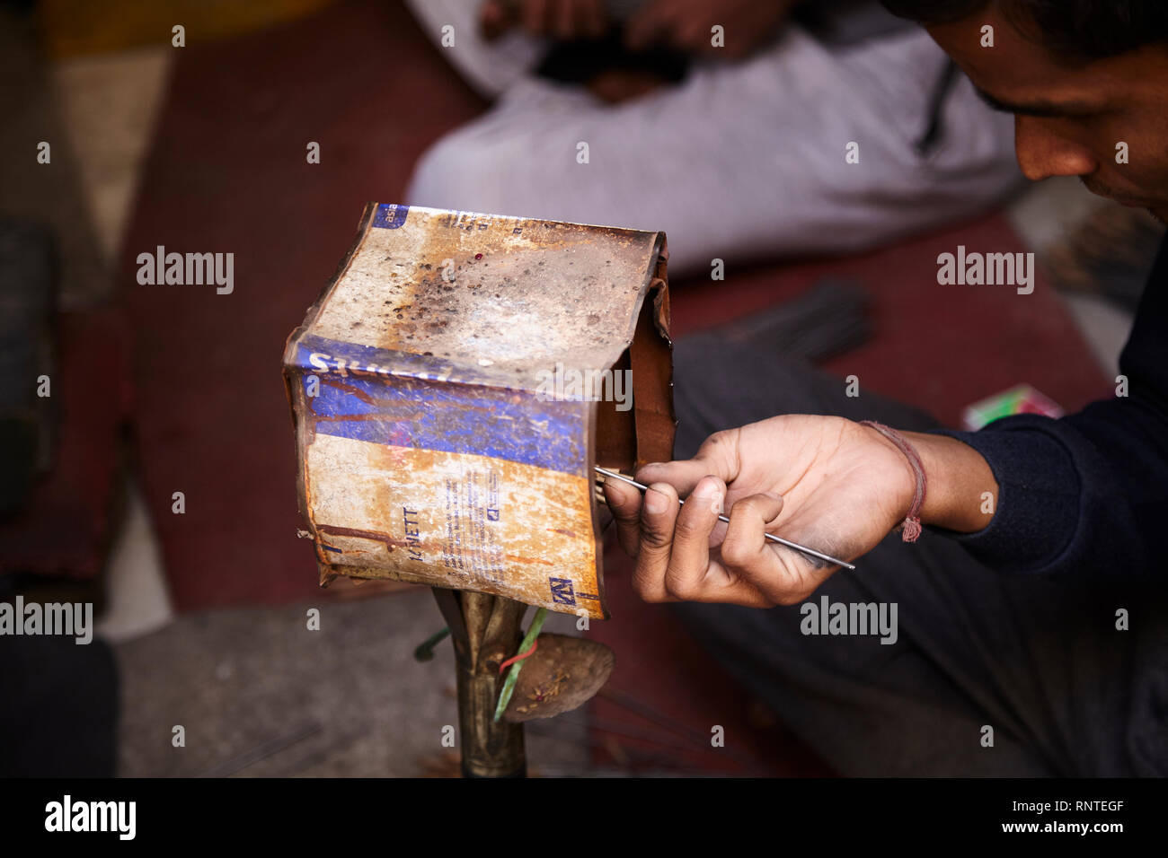 Craftsmen polishes precious stone in a small factory. Stock Photo