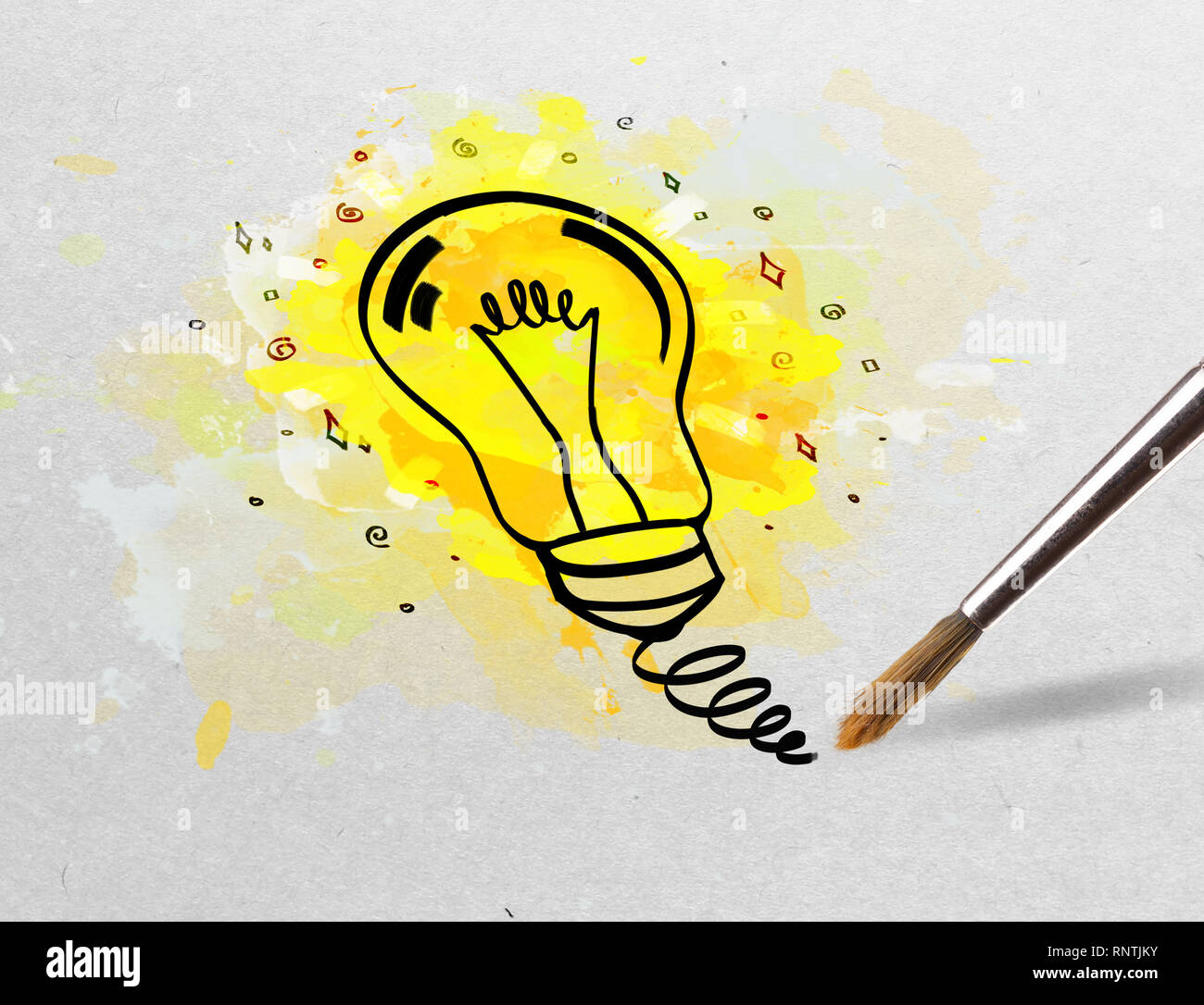 Drawing colorful bulb and multimedia symbols on white paper Stock Photo