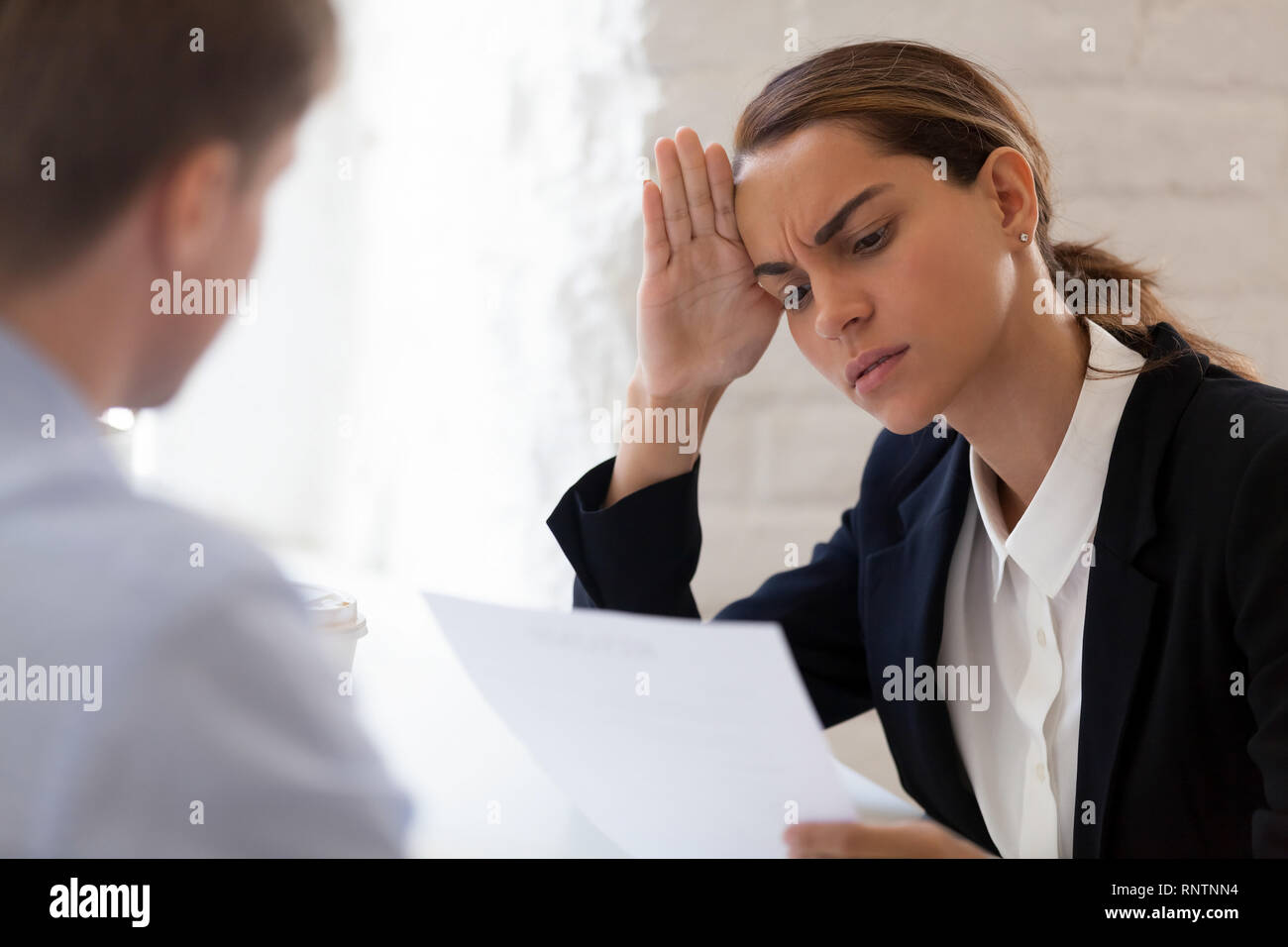 Confused hr manager interviewing unsuitable job candidate Stock Photo