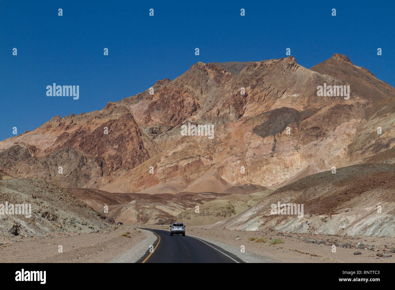 A car heading into the Artist 39 s - A Car Heading Into The Artists Palette Area Of Death Valley Death Valley National Park California United States RNTTC3 