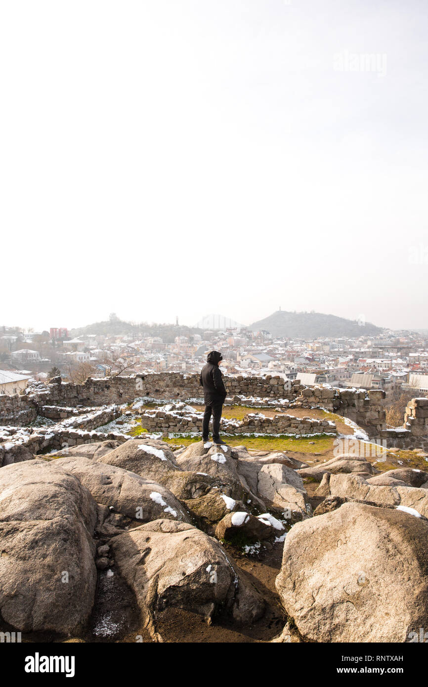 A man stands atop a view in Plovdiv, Bulgaria also known as the City of the Seven Hills Stock Photo