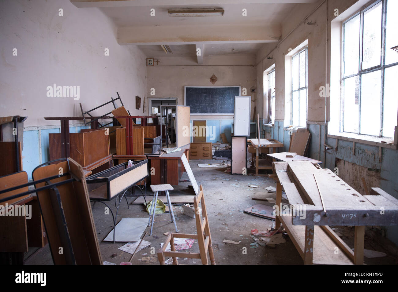 A photograph of Nicolae Ceaușescu hangs in the upper left corner Inside of  an abandoned chemistry classroom in Sinia, Romania Stock Photo - Alamy