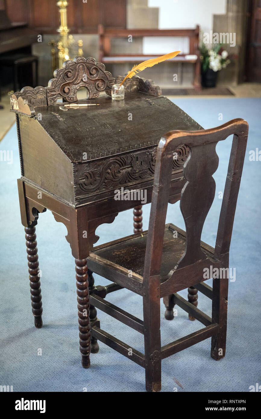 A writing desk and chair in St James’s Church, Thornton, Bradford, which was used by the Rev Patrick Bronte who was incumbent at the church Stock Photo