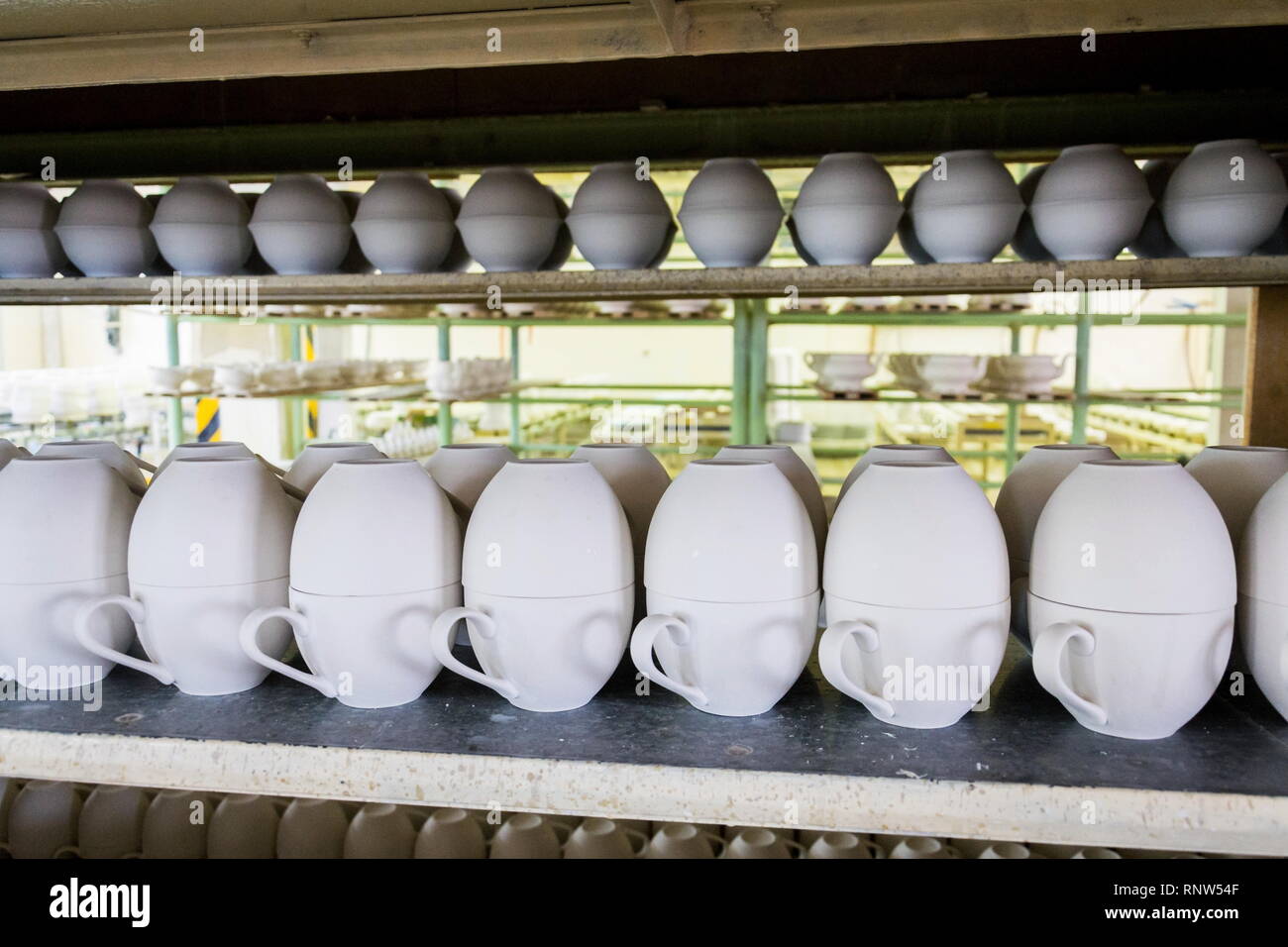 Traditional ceramics pottery on production line in factory Stock Photo