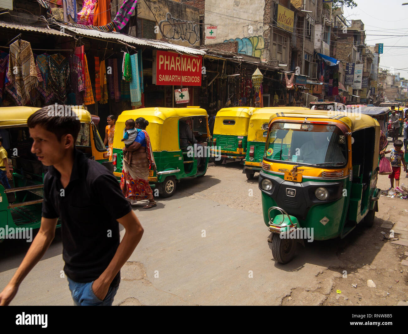 Street scene with many tuk tuks at Main Bazar Paharganj, New Delhi, India Stock Photo