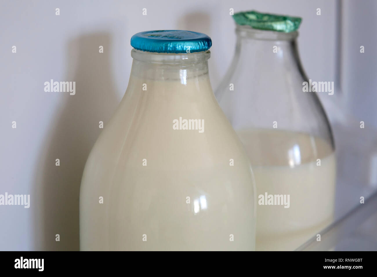 Reusable glass milk bottles are back in fashion in the UK as many consumers  do their best to reduce, reuse and recycle. Whole and semi skimmed organic  Stock Photo - Alamy
