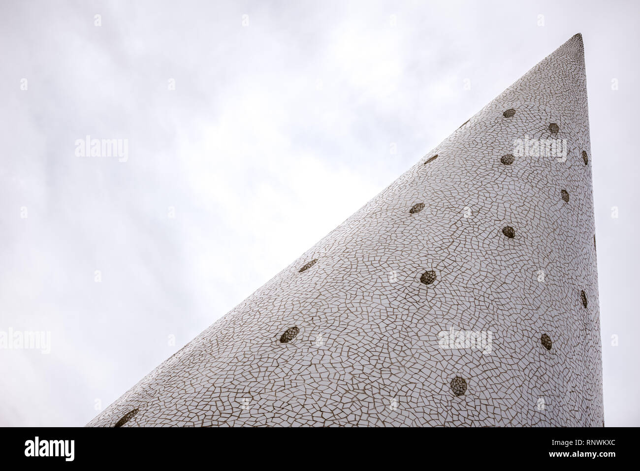 Large Concrete Cone With Small White Tiles Like A Modern Fireplace