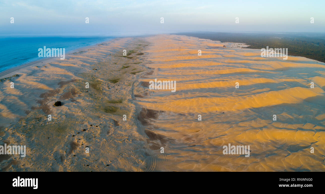 Aerial panorama of Stockton beach sand dunes at sunrise. Anna Bay, New South Wales, Australia