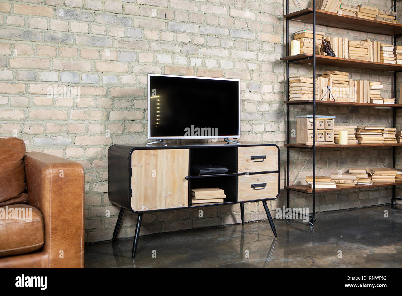 Tv In The Interior In Loft Style On The Bedside Table Stock Photo Alamy