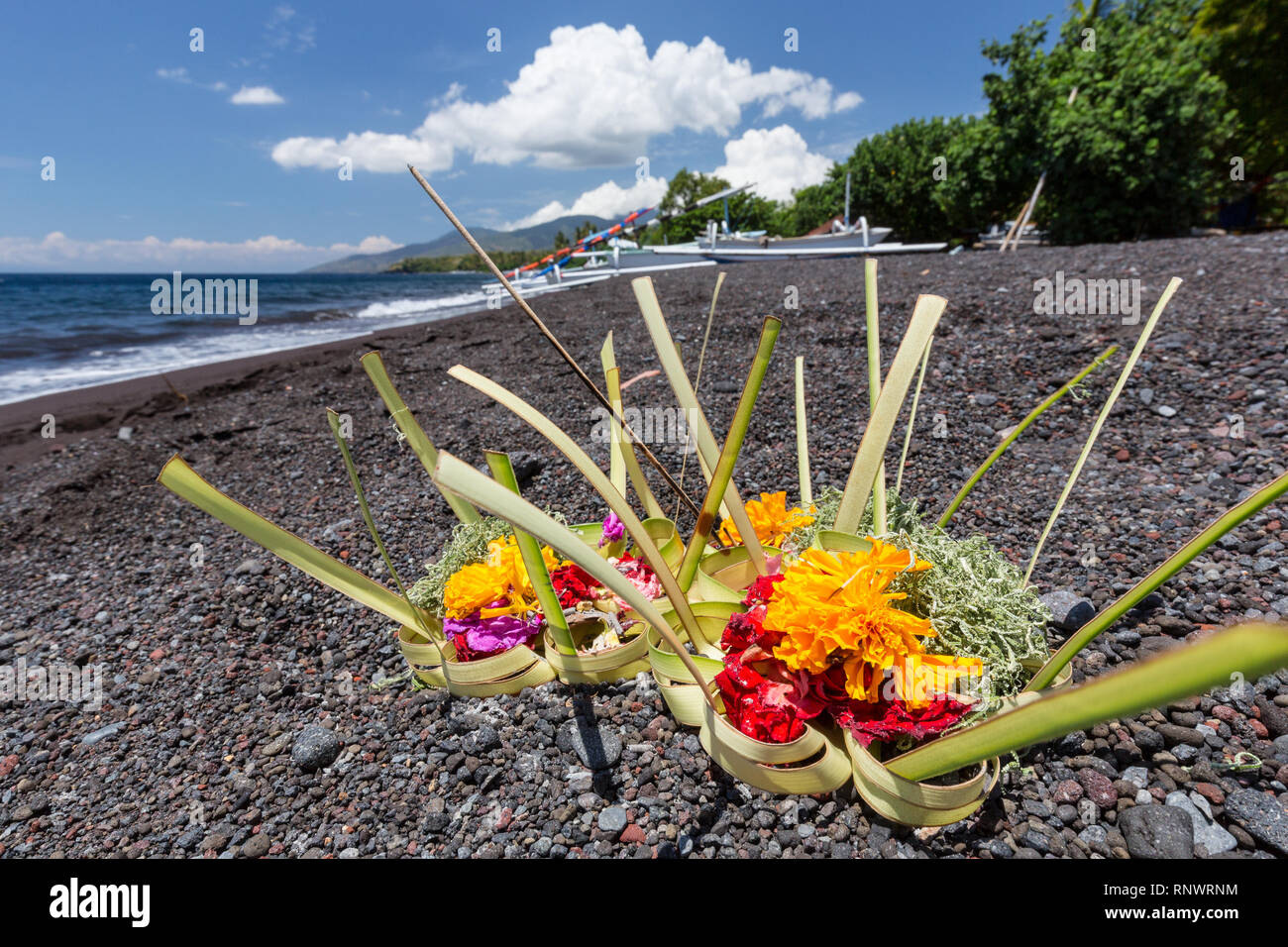 Offerings laid out on the beach is a common sight in Tulamben, Bali. Stock Photo