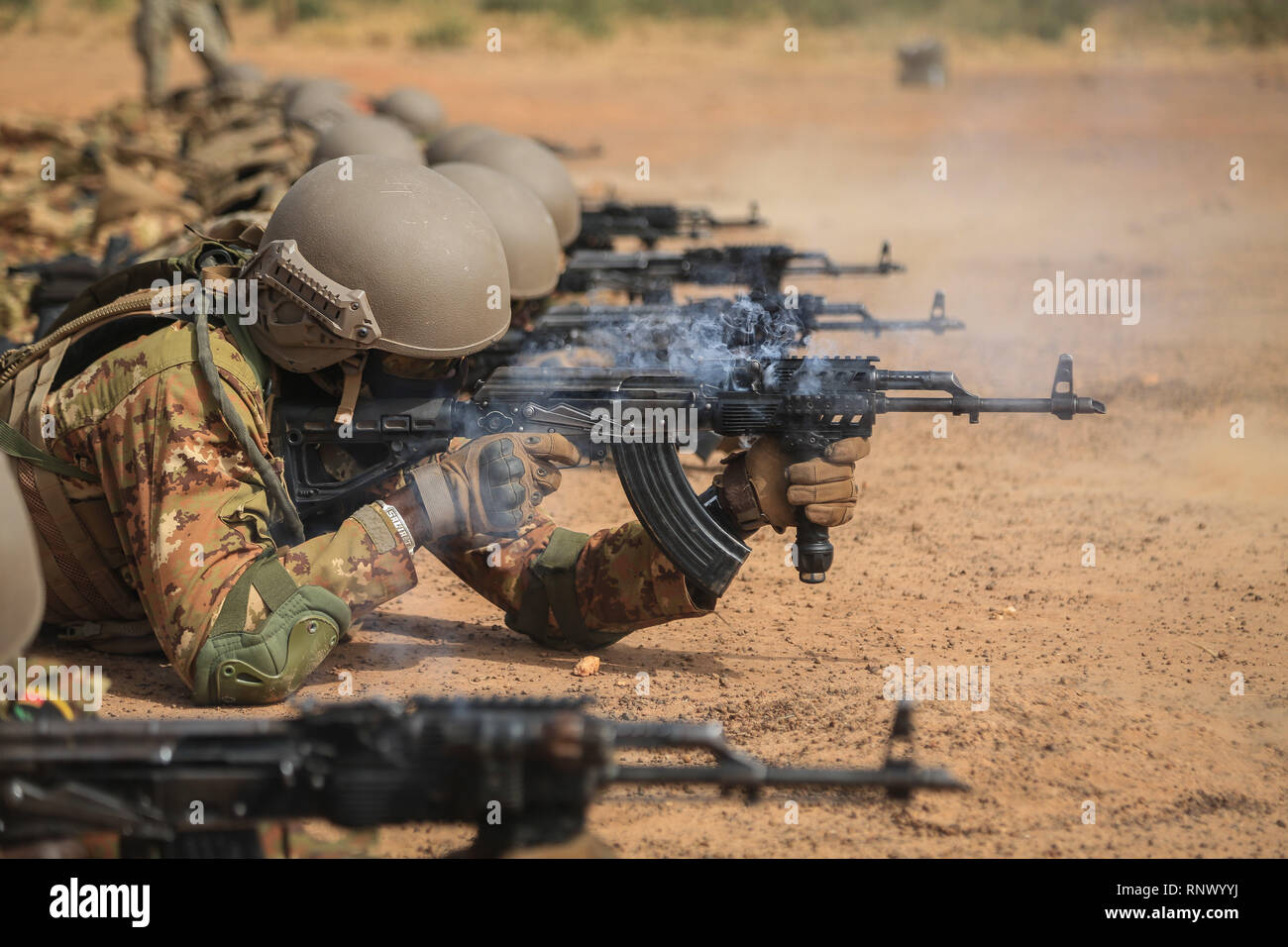 Malian soldiers zero their weapons near Loumbila, Burkina Faso Feb. 17, 2019. The live fire range presented an opportunity during exercise Flintlock 19 for the Malian Soldiers to maintain accurate weapons and tactics. Flintlock 2019 builds the capacity of participating nations to support regional cooperation, security and interoperability. (U.S Army photo by Spc. Peter Seidler) Stock Photo