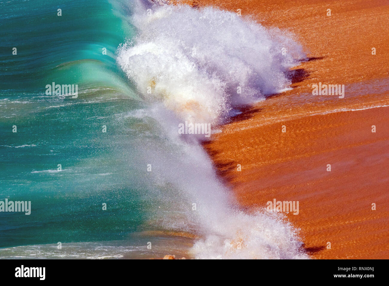 Soft blue ocean wave on sandy beach. Background. Stock Photo