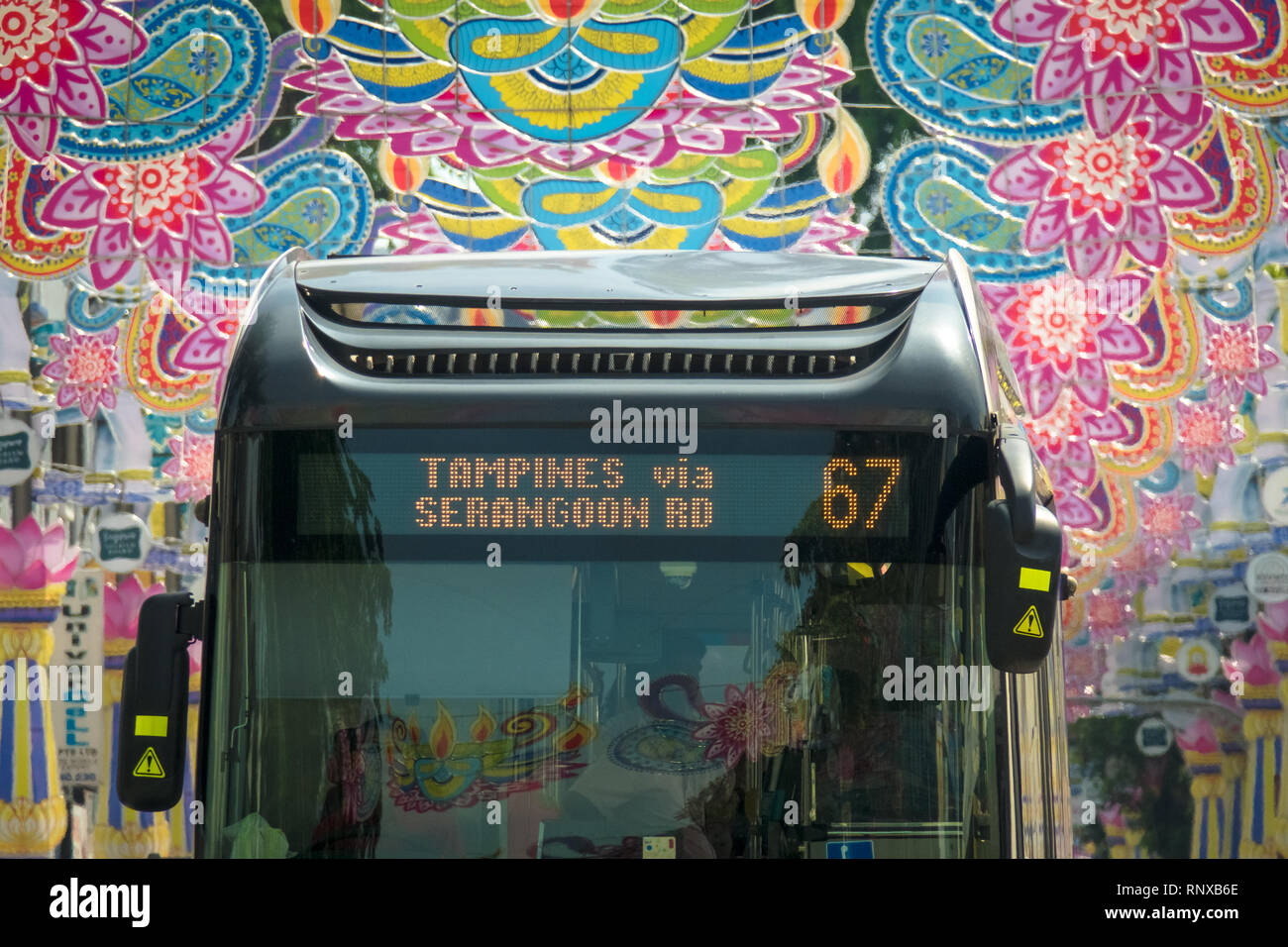Public bus closeup under colorful Deepavali Festival Decorations in Little India, Singapore Stock Photo