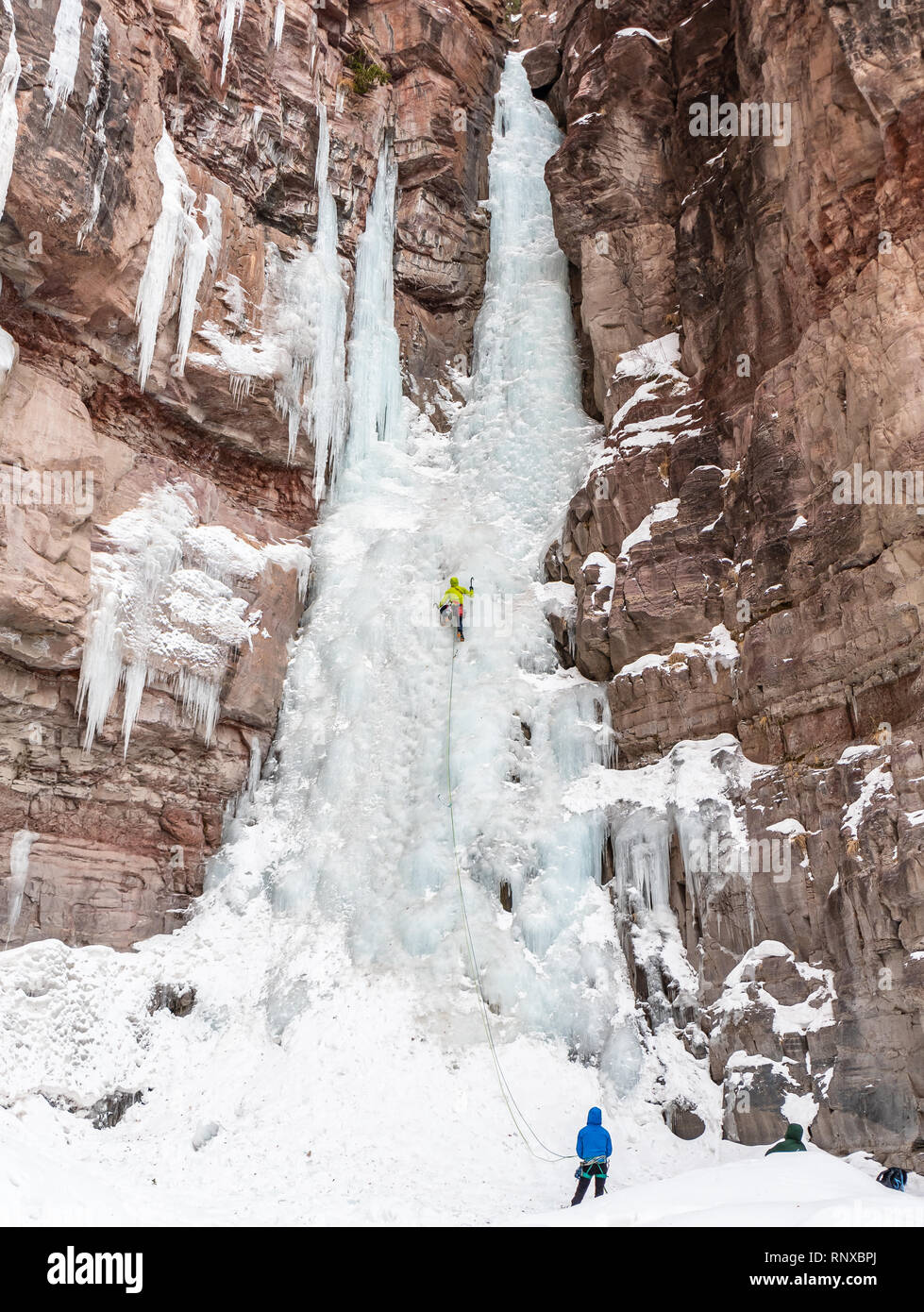 Elijah er climbing a route called Charmin Tube rated WI3/4 near