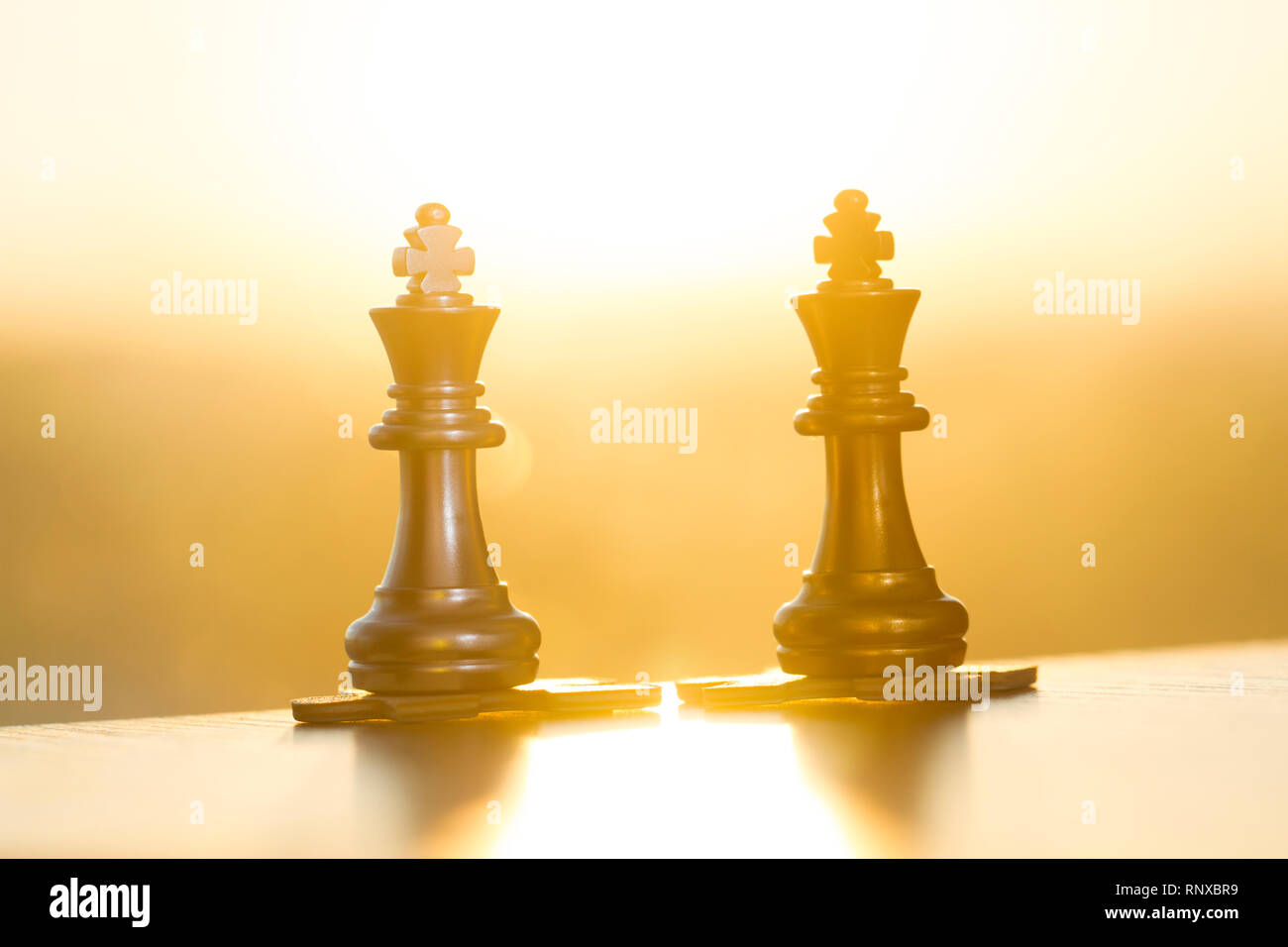 Chess pieces and puzzles, teamwork Stock Photo Alamy