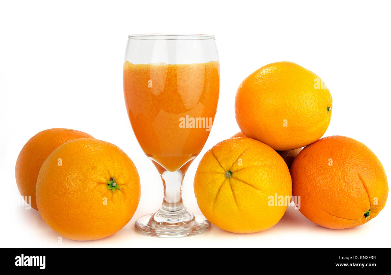 Fresh squeezed orange juice and oranges on a white background Stock