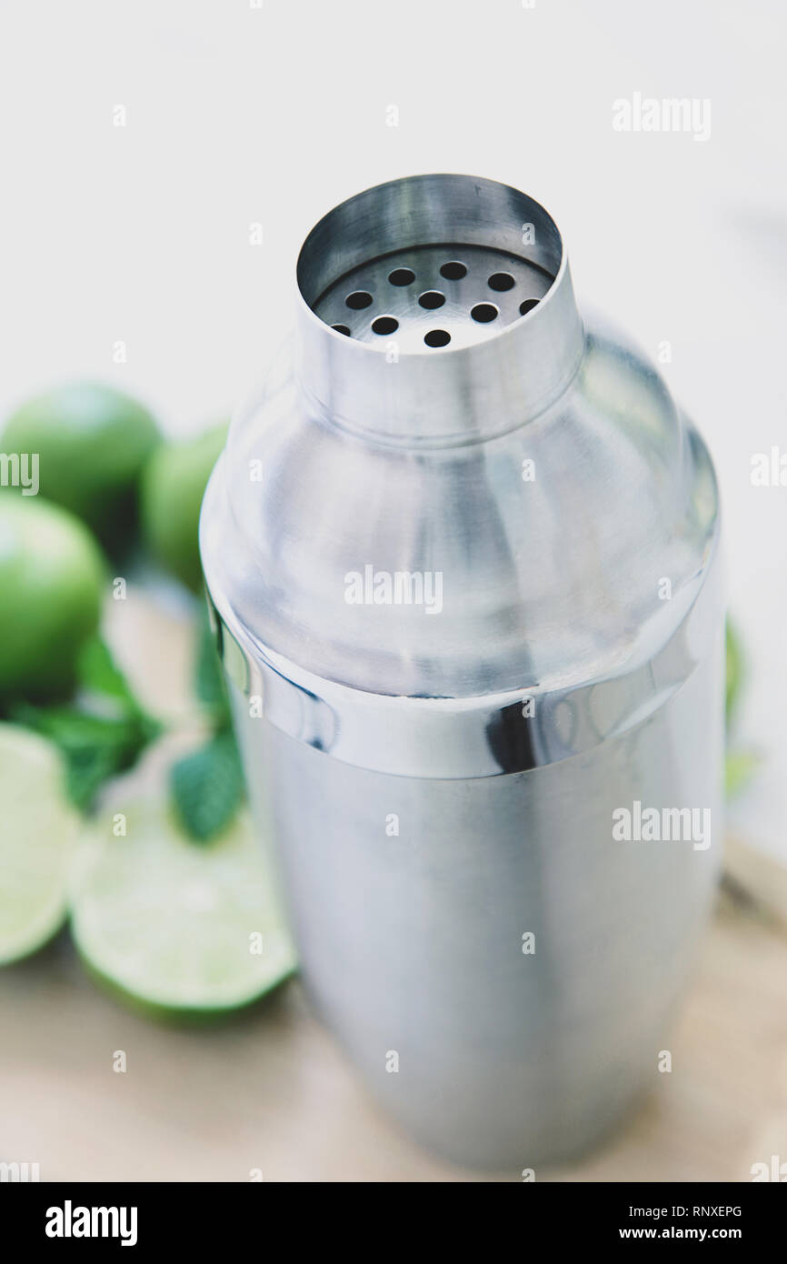Cocktail Shaker with limes Stock Photo