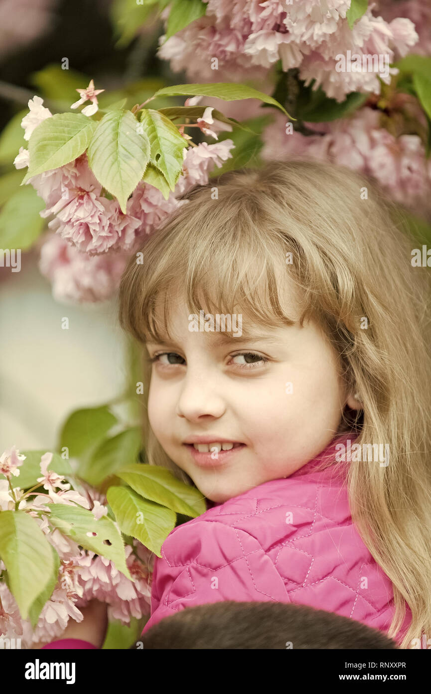 Girl smile with cherry blossom, beauty. Little child with sakura flowers,  spring. Youth, bloom, freshness. Beauty, look, hair hairstyle Spring easter  holidays celebration Stock Photo - Alamy
