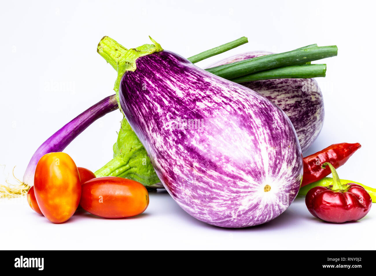 Various vegetables on white background. Horizontal view Vegetables colored several colors on neutral background. Organic vegan or vegetarian food. Stock Photo