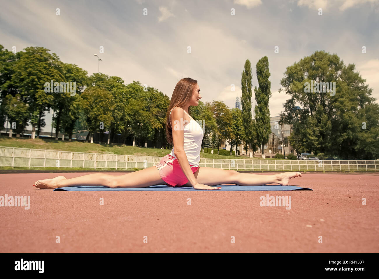 Woman Workout And Stretching On Fitness Mat Sunny Summer Outdoor