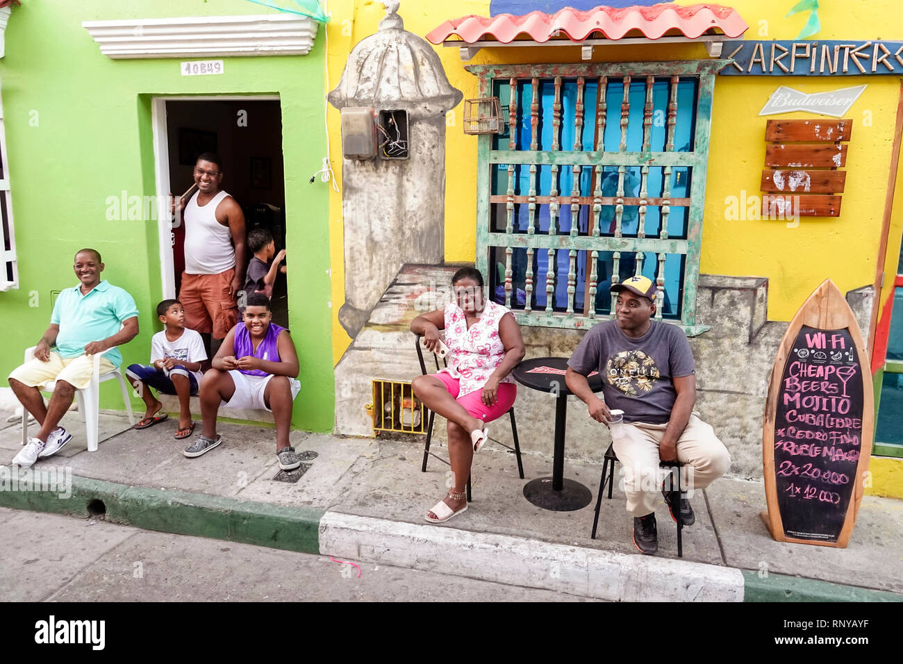 Cartagena Colombia,Center,centre,Getsemani,neighborhood,doorway,Karpinteros bar,wall mural,exterior,Black,Afro Caribbean,Hispanic Latinos,immigrant im Stock Photo