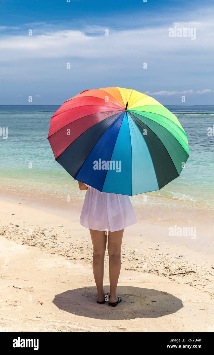 Colorful umbrella lady at the coast of Indonesia, Gili Trawangan Island